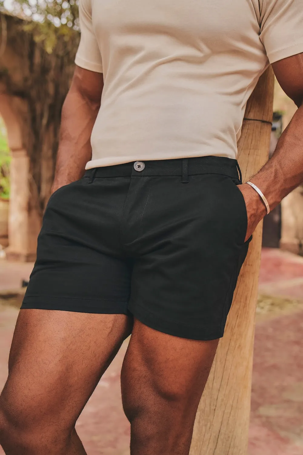 Black chino shorts with a sand t-shirt